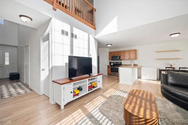 a view of closet area with wooden floor