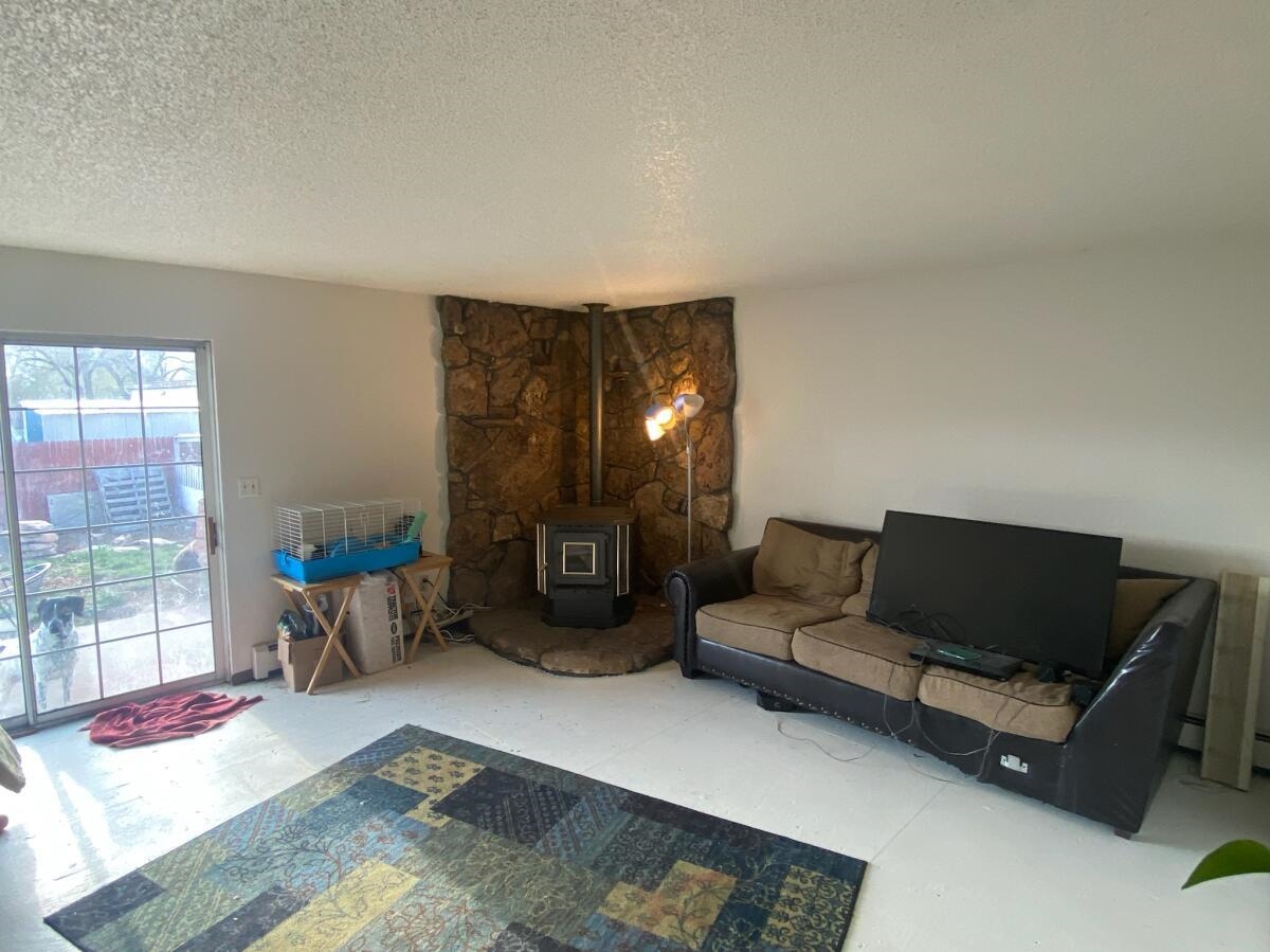 321 North Ash Street Fruita, CO 81521 - Photo 2 of 7 a living room with furniture and a fireplace