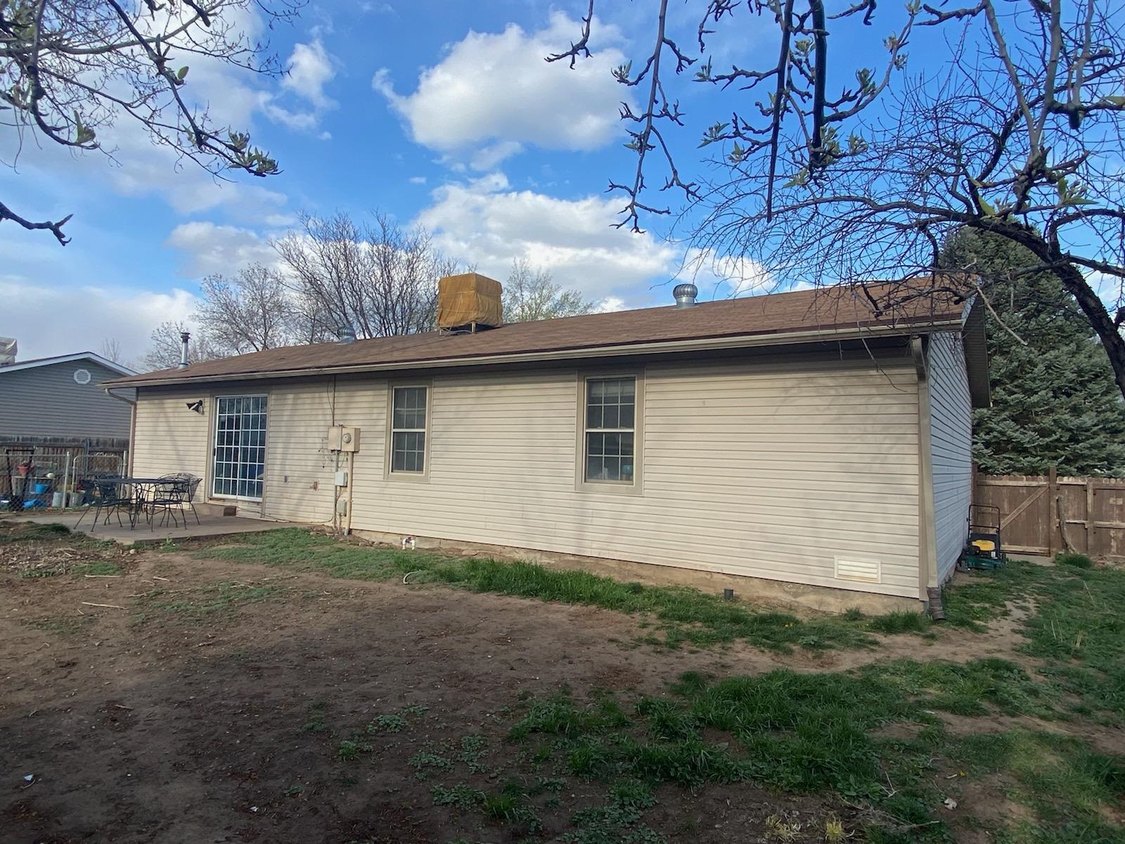 321 North Ash Street Fruita, CO 81521 - Photo 5 of 7 a side view of a house with a garden