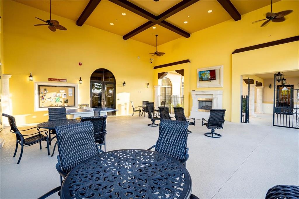 20201 Ragazza Circle, Unit 201 Venice, FL 34293 - Photo 48 of 58 a living room with furniture and a large window