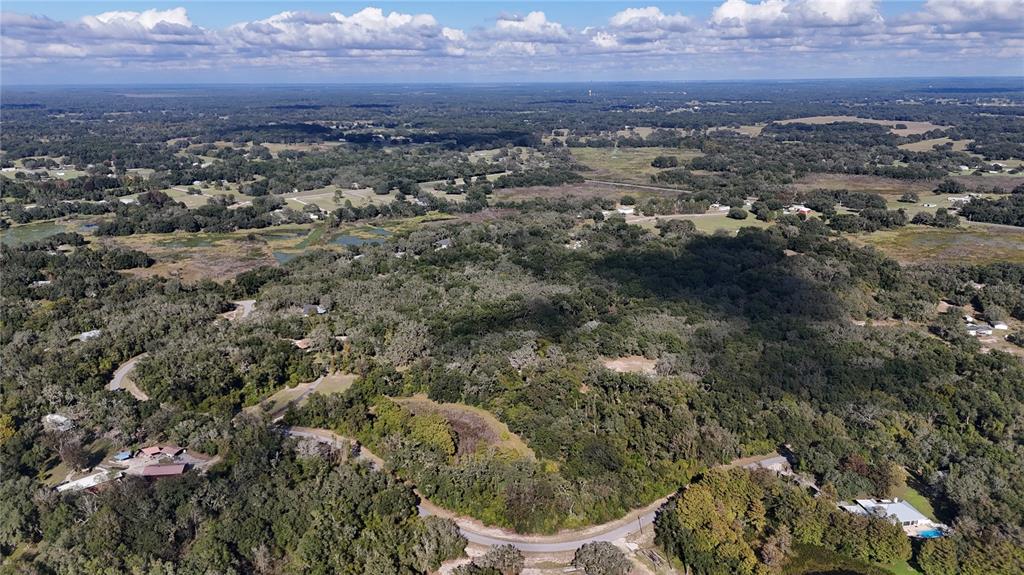8735 Cr 631a Bushnell Bushnell, FL 33513 - Photo 5 of 17 an aerial view of residential house and car parked