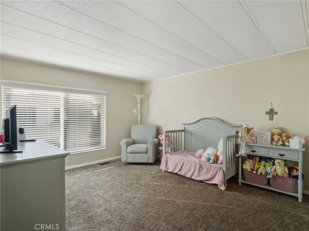 1051 Site, Unit 236 Brea, CA 92821 - Photo 14 of 19 a bedroom with bed and a window