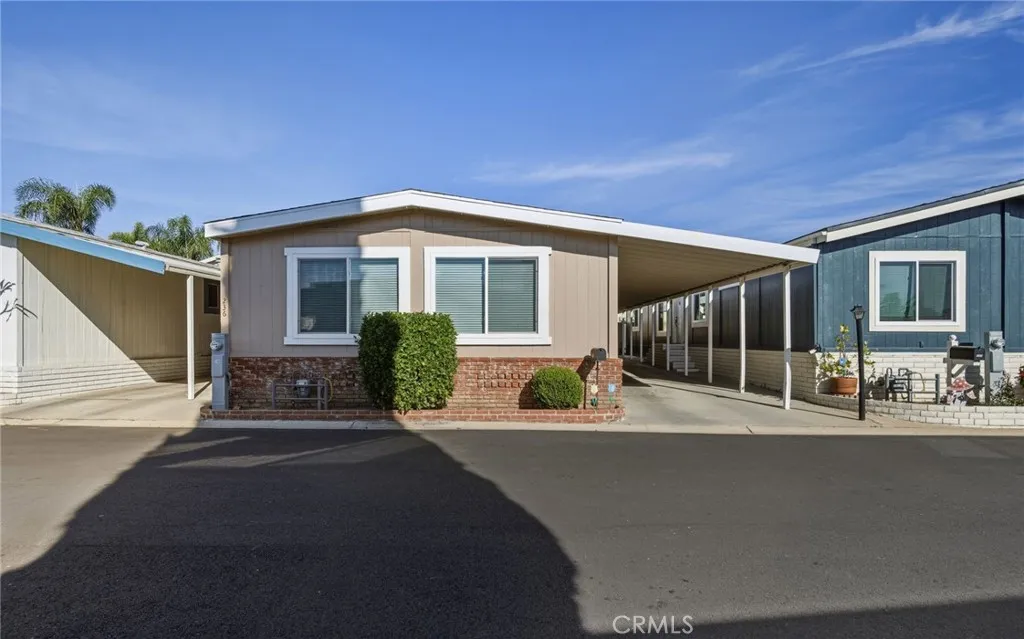 1051 Site, Unit 236 Brea, CA 92821 - Photo 17 of 19 a front view of a house with a yard