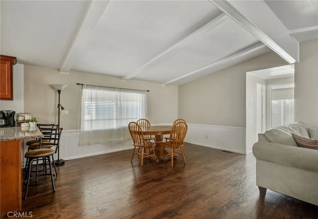 1051 Site, Unit 236 Brea, CA 92821 - Photo 5 of 19 a dining room with furniture and wooden floor