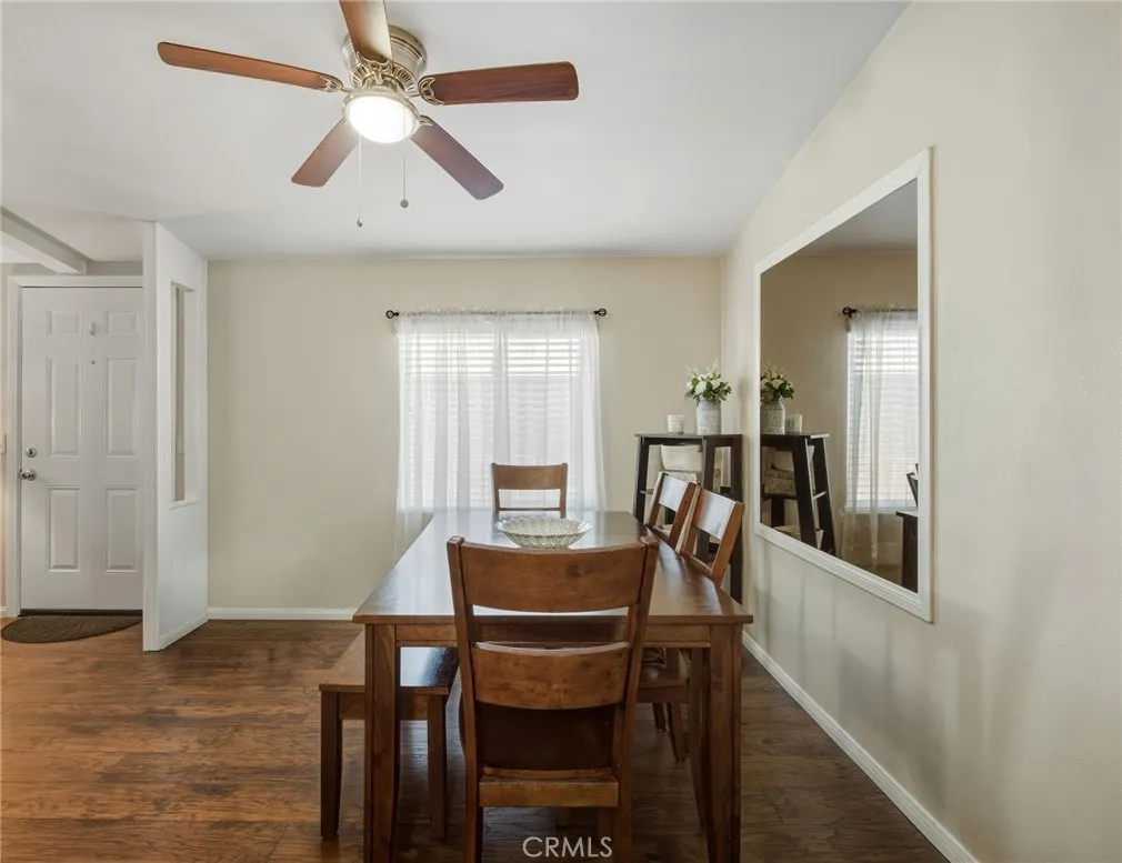 1051 Site, Unit 236 Brea, CA 92821 - Photo 8 of 19 a view of a dining room with furniture and a chandelier fan