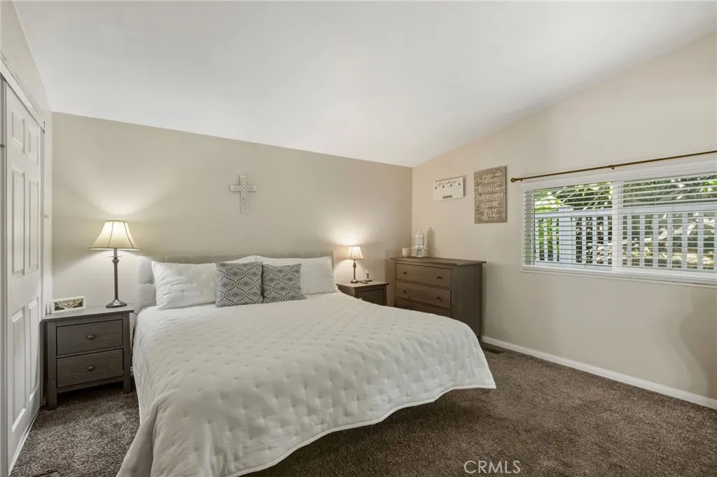 1051 Site, Unit 236 Brea, CA 92821 - Photo 9 of 19 a bedroom with a bed and a night stand