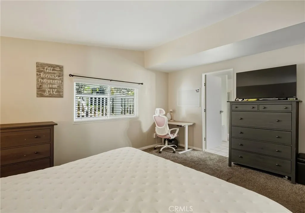 1051 Site, Unit 236 Brea, CA 92821 - Photo 10 of 19 a bedroom with a bed and a television