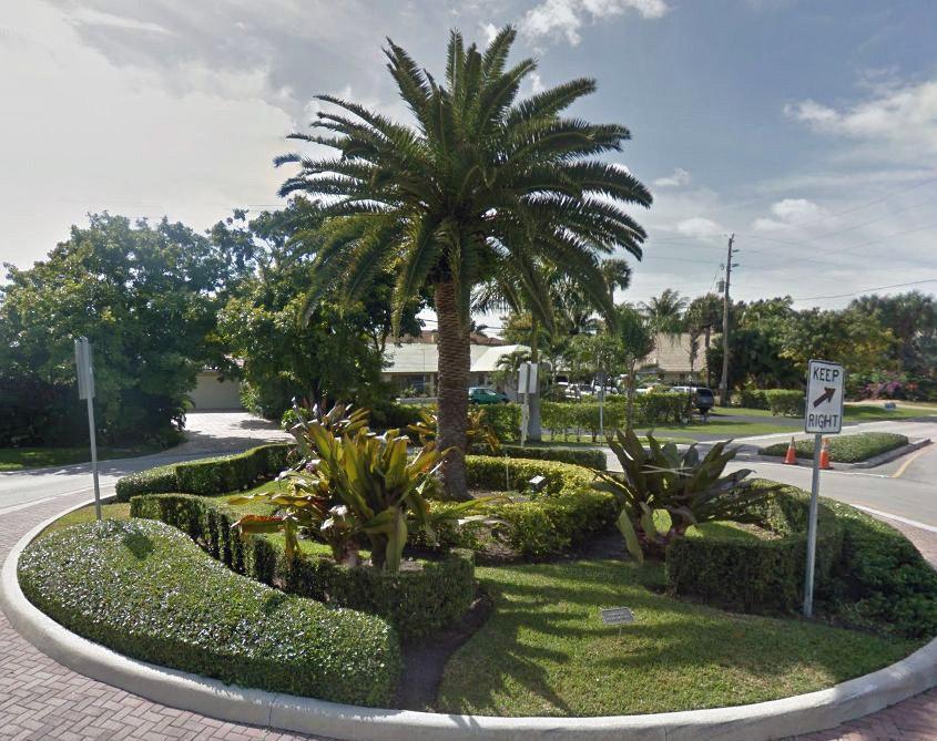 1911 Northeast 27th Court, Unit 13 Lighthouse Point, FL 33064 - Photo 43 of 61 a view of a park with large trees