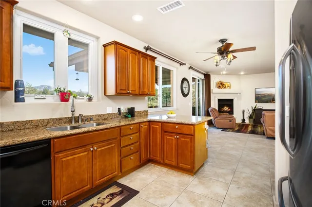 wooden floor fireplace and natural light in a room