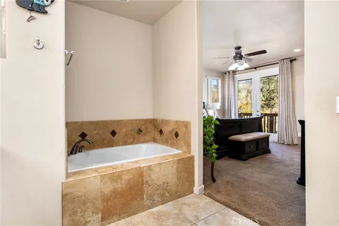 a bathroom with a sink vanity mirror and toilet