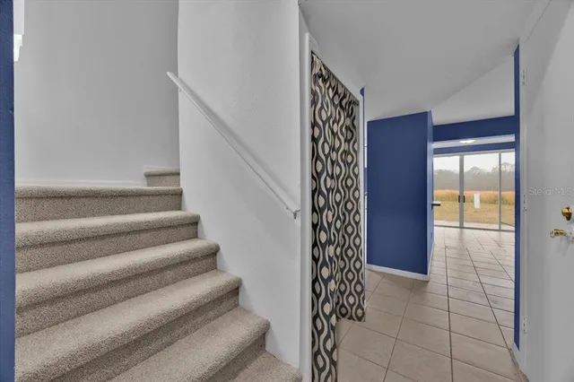 a view of entryway with stairs