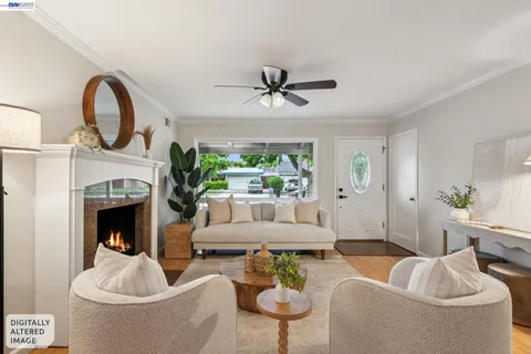 a living room with a fireplace and a wooden floor