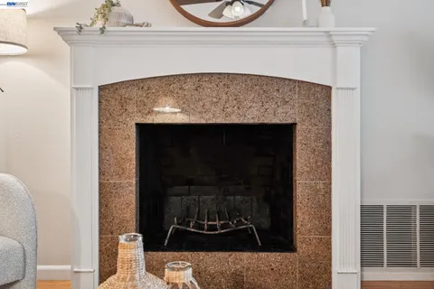 a living room with a fireplace and a fireplace