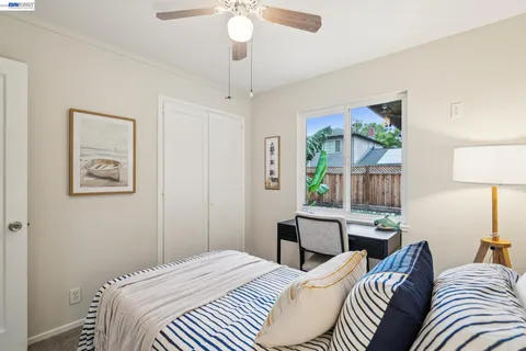 a bedroom with a bed and a table in it