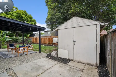 a outdoor living space with furniture and a garden