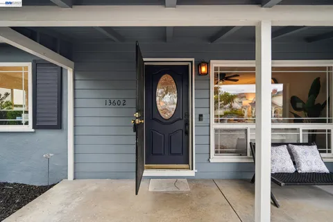 a grandfather clock sitting in the corner of a house