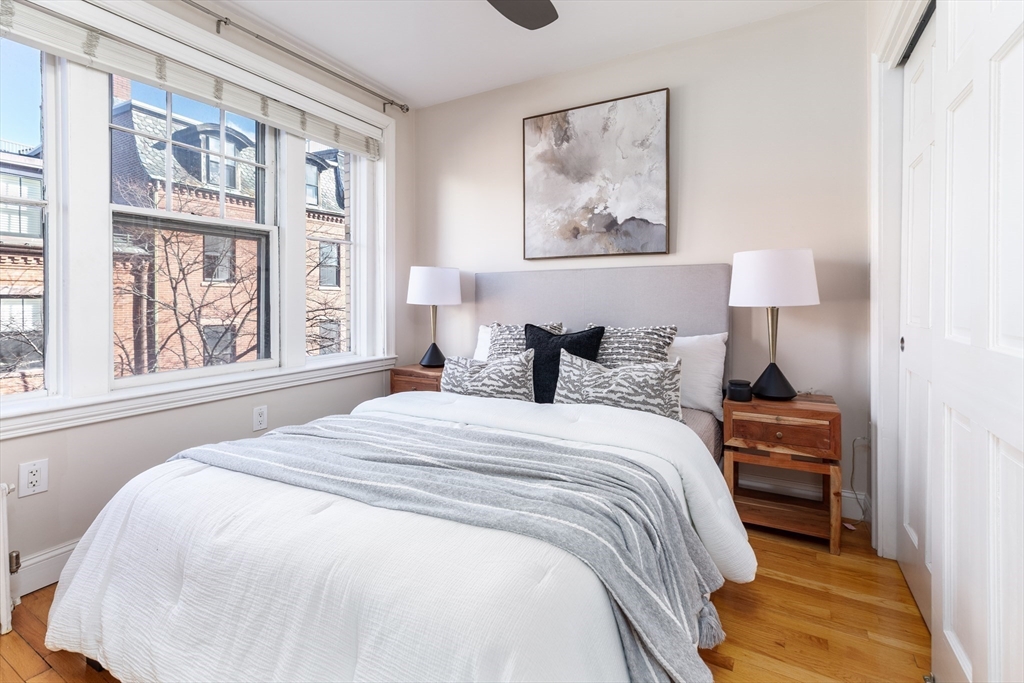 76 West Cedar Street, Unit 4F Boston, MA 02114 - Photo 18 of 22 a bedroom with a bed and a painting on the wall