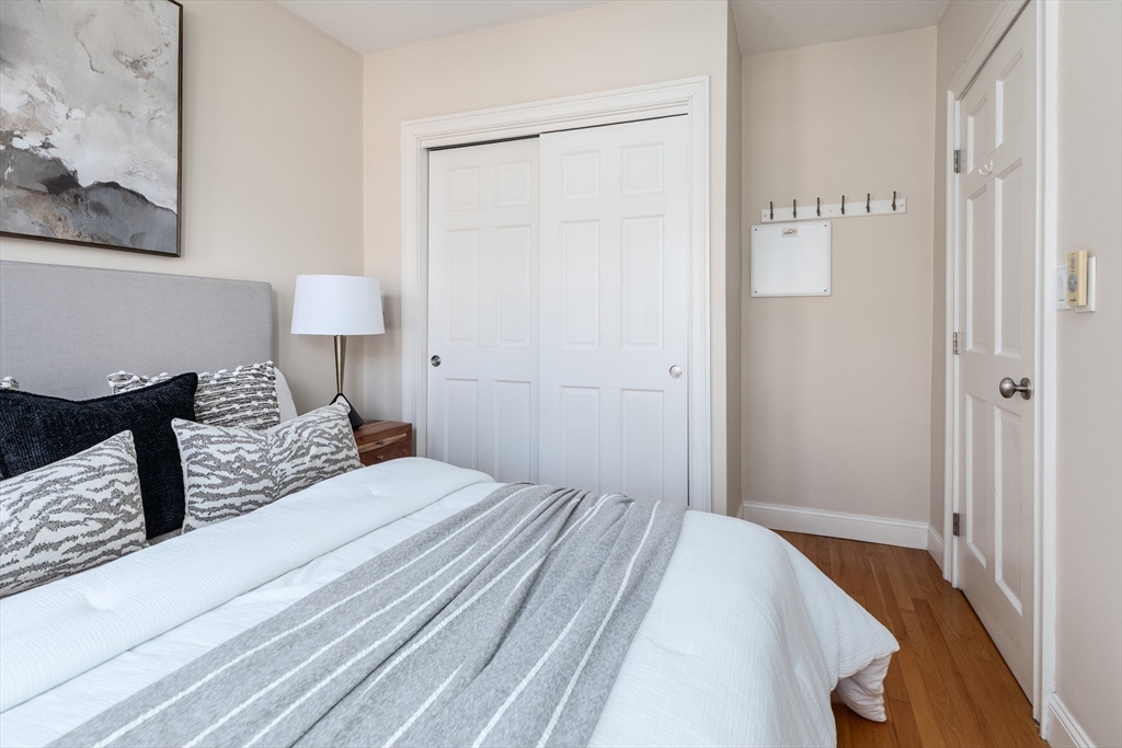 76 West Cedar Street, Unit 4F Boston, MA 02114 - Photo 19 of 22 a bedroom with a bed and a night stand