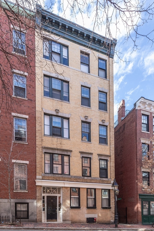 76 West Cedar Street, Unit 4F Boston, MA 02114 - Photo 22 of 22 a front view of a building with glass windows