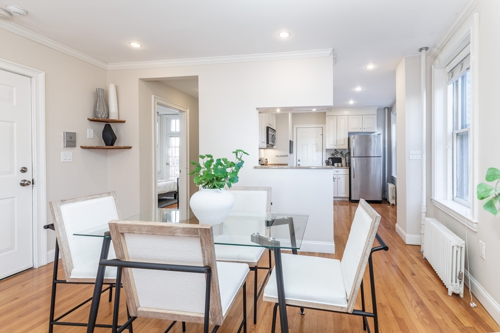 76 West Cedar Street, Unit 4F Boston, MA 02114 - Photo 5 of 22 a view of a dining room with furniture and a window