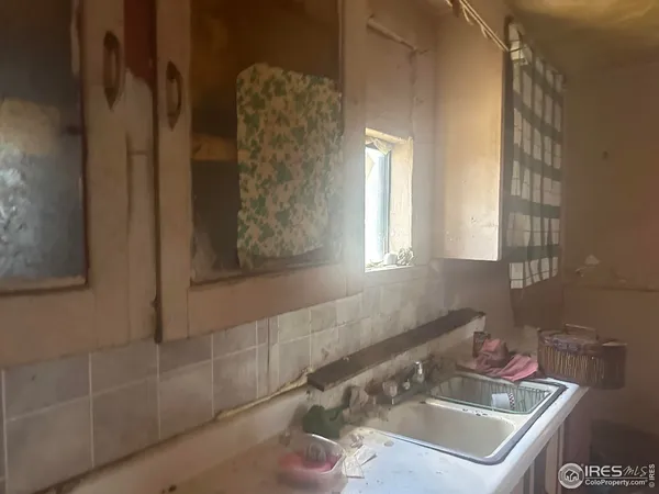 a bathroom with a sink and a window