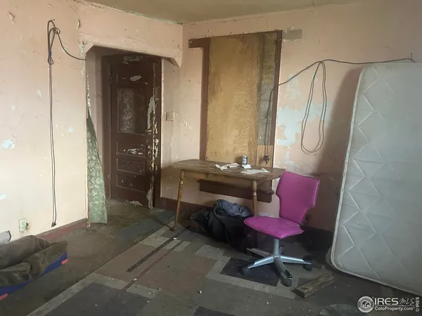 a bathroom with a granite countertop sink a toilet a mirror and shower