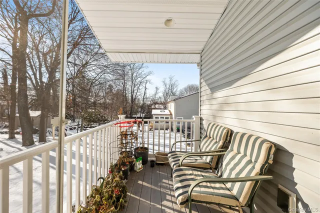 a view of balcony with furniture
