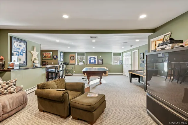 a living room with furniture and kitchen view