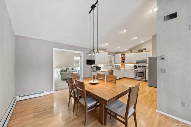 a view of a dining room with furniture