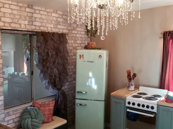 a bedroom with bed and a mirror