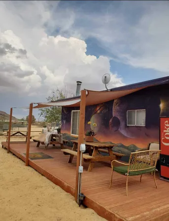 a view of a patio with swimming pool and furniture