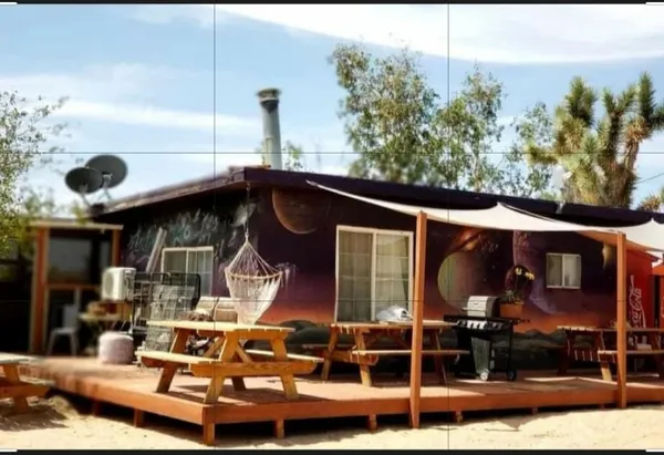a view of a house with a couches in a patio