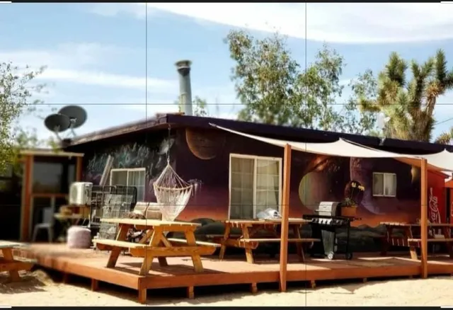 a view of a house with a couches in a patio
