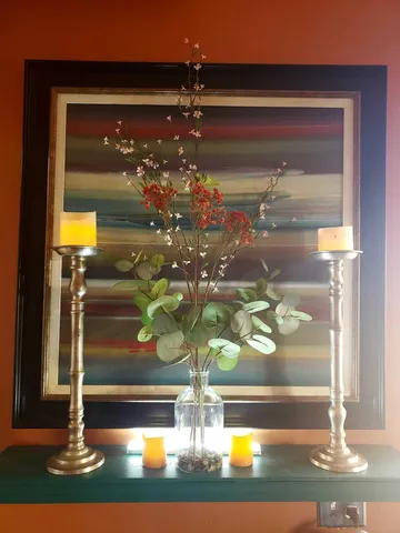a kitchen with a refrigerator and a stove