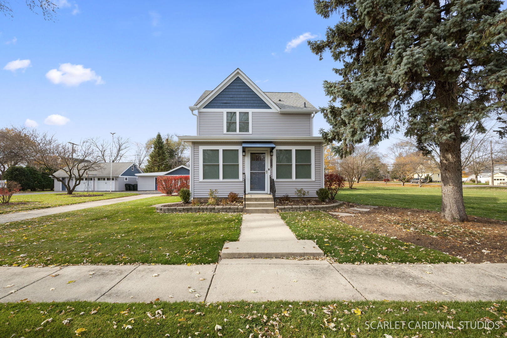 a front view of a house with a yard