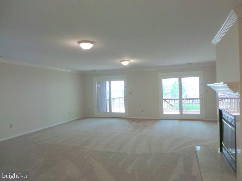 738 Bellefield Road, Unit 99 Dowell, MD 20629 - Photo 25 of 30 Huge Living Rm w/ Fireplace & Sliders to Deck