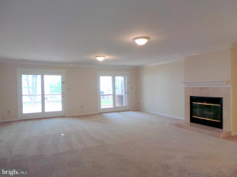 738 Bellefield Road, Unit 99 Dowell, MD 20629 - Photo 5 of 30 Huge Living Rm w/ Fireplace & Sliders to Deck