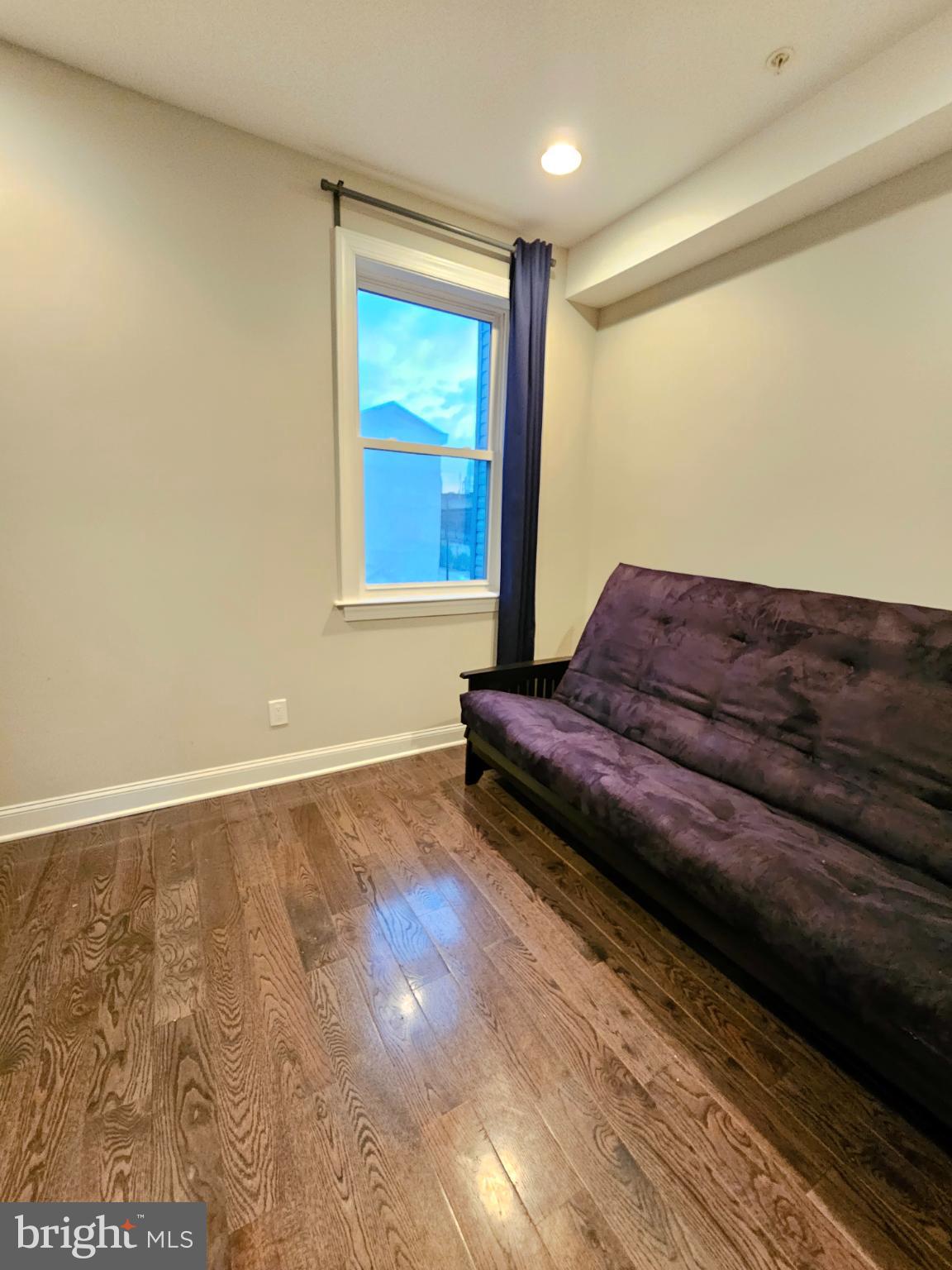 742-00 Master Street, Unit 2 Philadelphia, PA 19122 - Photo 12 of 17 a living room with a couch and a rug