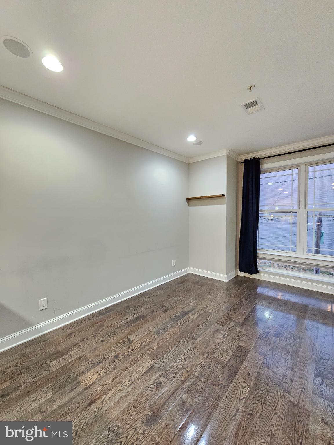 742-00 Master Street, Unit 2 Philadelphia, PA 19122 - Photo 10 of 17 an empty room with wooden floor and windows