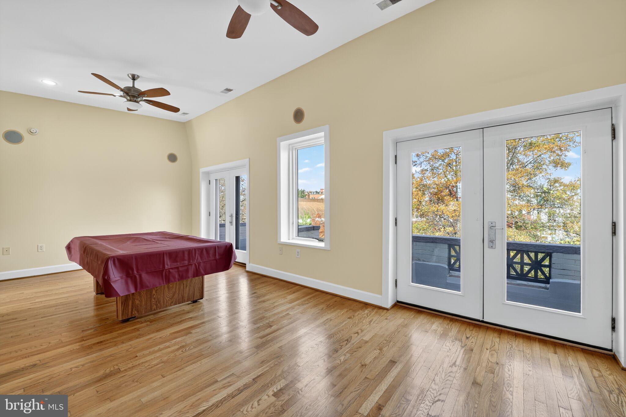 1000 Park Road Northwest Washington, DC 20010 - Photo 13 of 30 a spacious bedroom with a bed and wooden floor