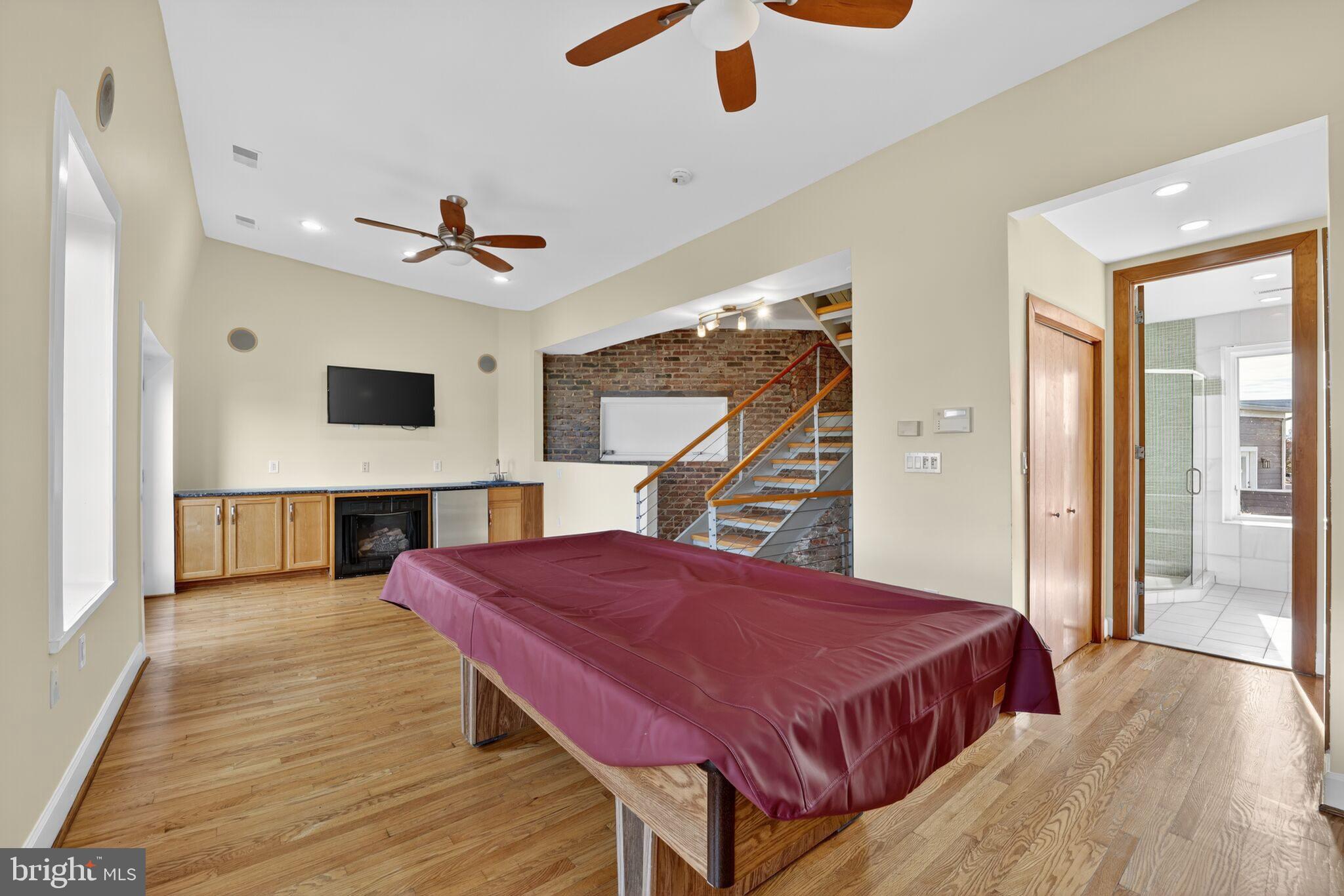 1000 Park Road Northwest Washington, DC 20010 - Photo 14 of 30 a spacious bedroom with a bed and a chandelier