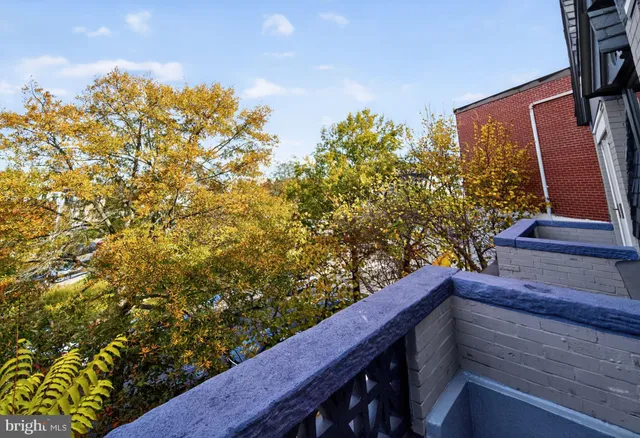 a view of balcony with wooden floor