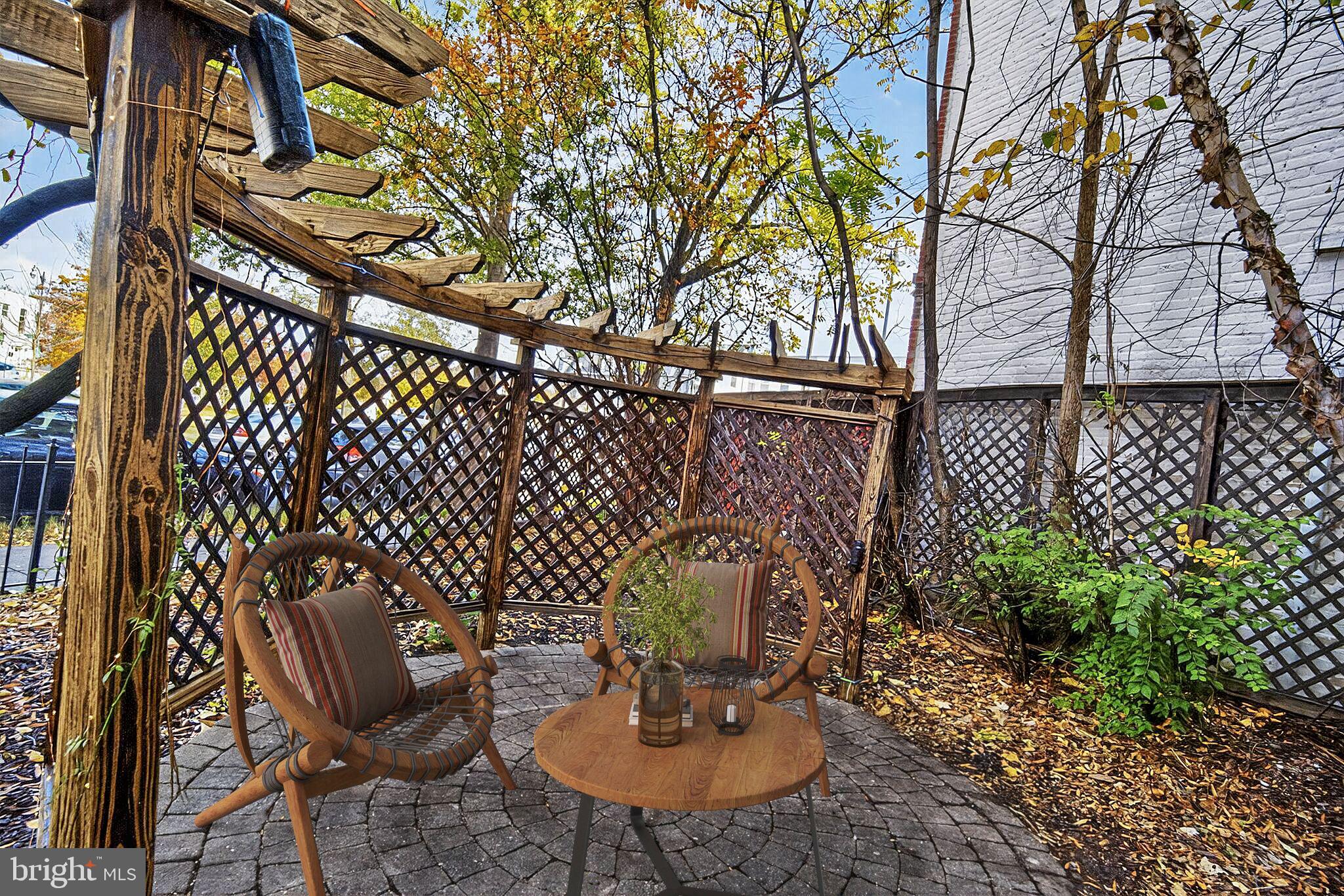 1000 Park Road Northwest Washington, DC 20010 - Photo 21 of 30 a backyard of a house with table and chairs