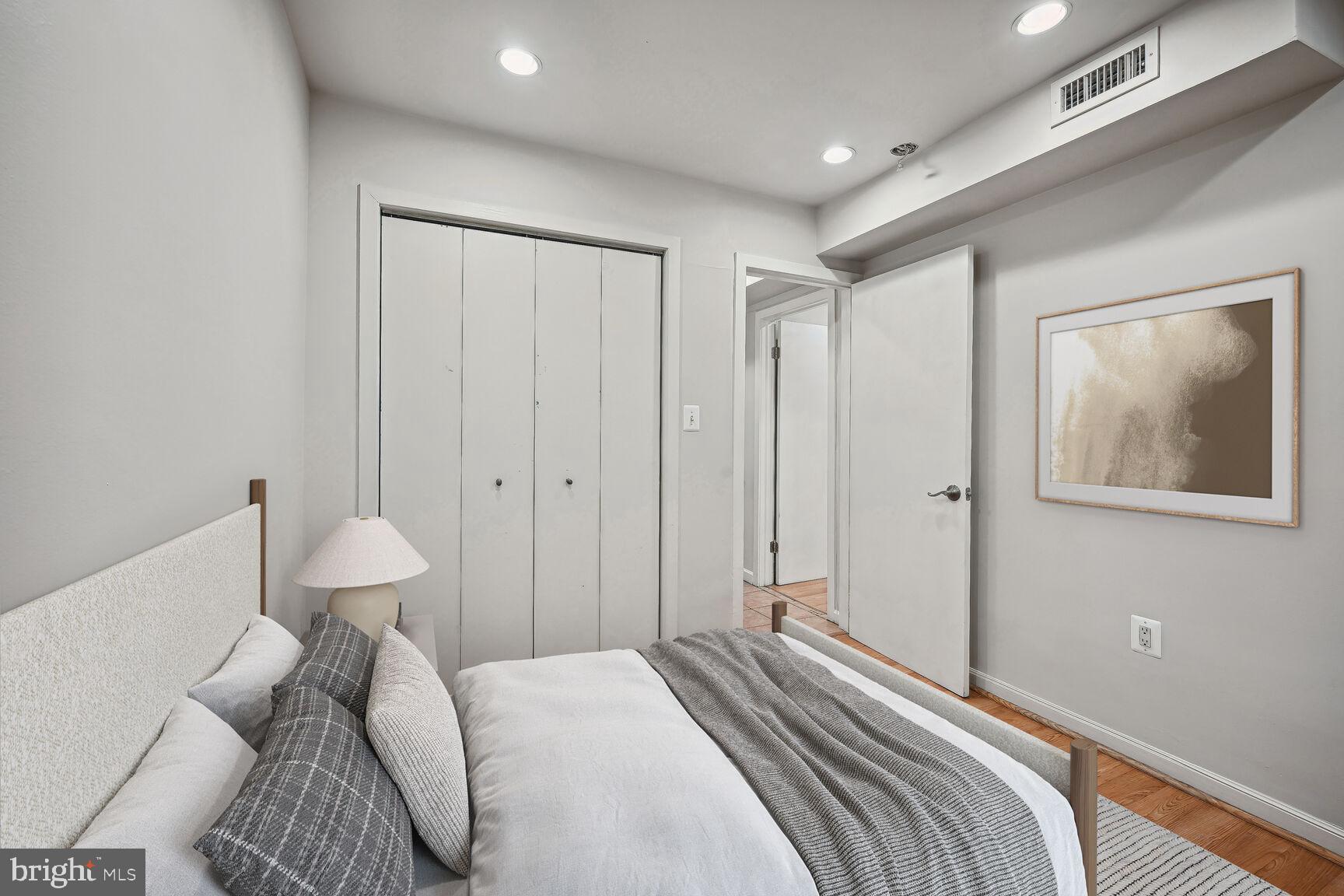 1000 Park Road Northwest Washington, DC 20010 - Photo 26 of 30 a bedroom with a bed and a painting on the wall