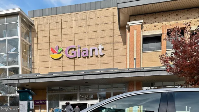 a view of a door with wooden bench