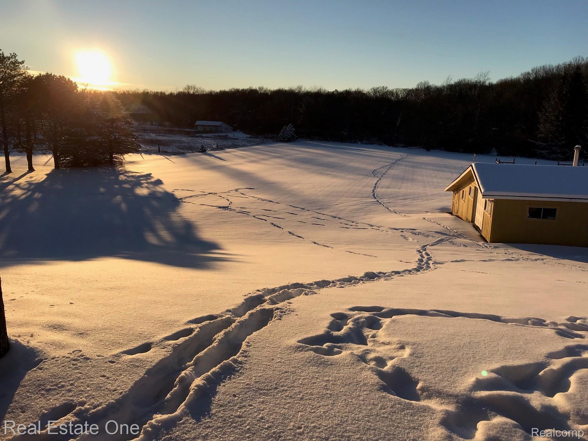 2572 Lake George Road Oakland, MI 48363 - Photo 79 of 83 Gorgeous rolling backyard winter scene at sunset...