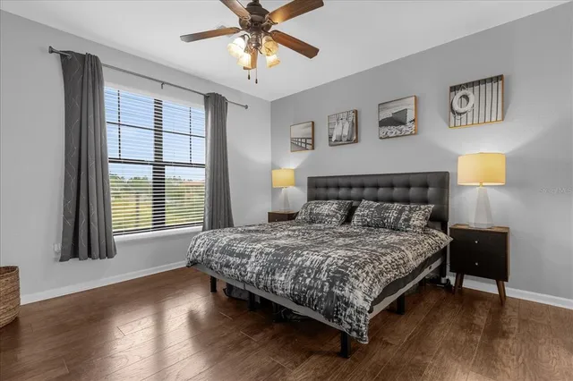 a bedroom with a bed and a television