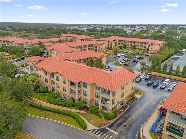 an aerial view of residential houses and outdoor space