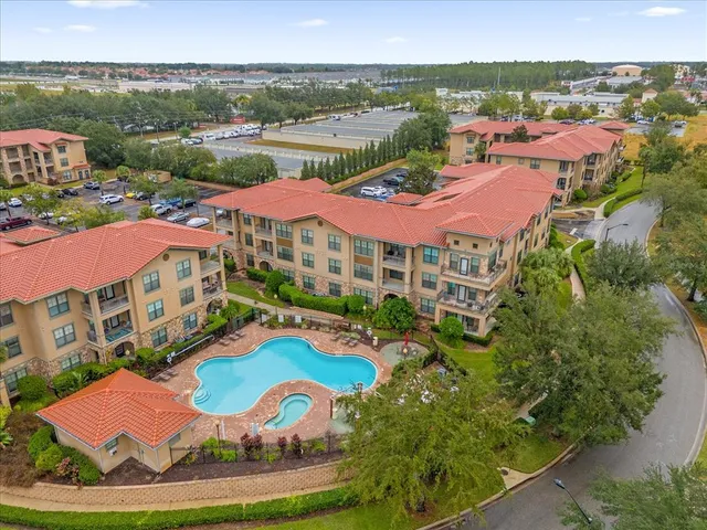 an aerial view of a swimming pool and outdoor space