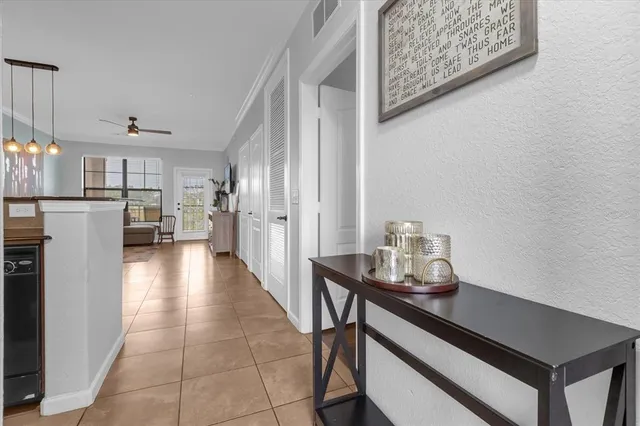 a kitchen with stainless steel appliances kitchen island granite countertop a refrigerator and a sink